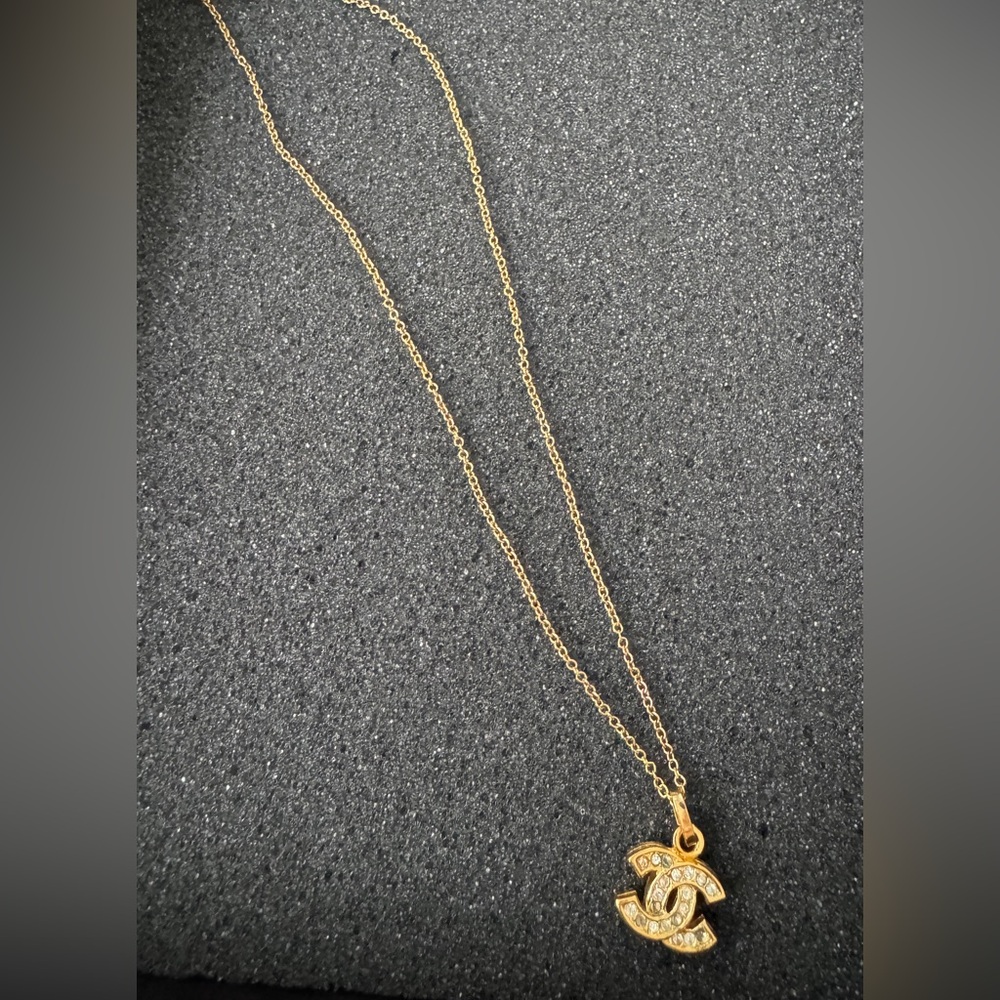 Authentic Vintage 2011 Chanel gold tone necklace stamped with stones